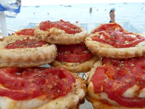 puff pastry snack with white cheese and tomato